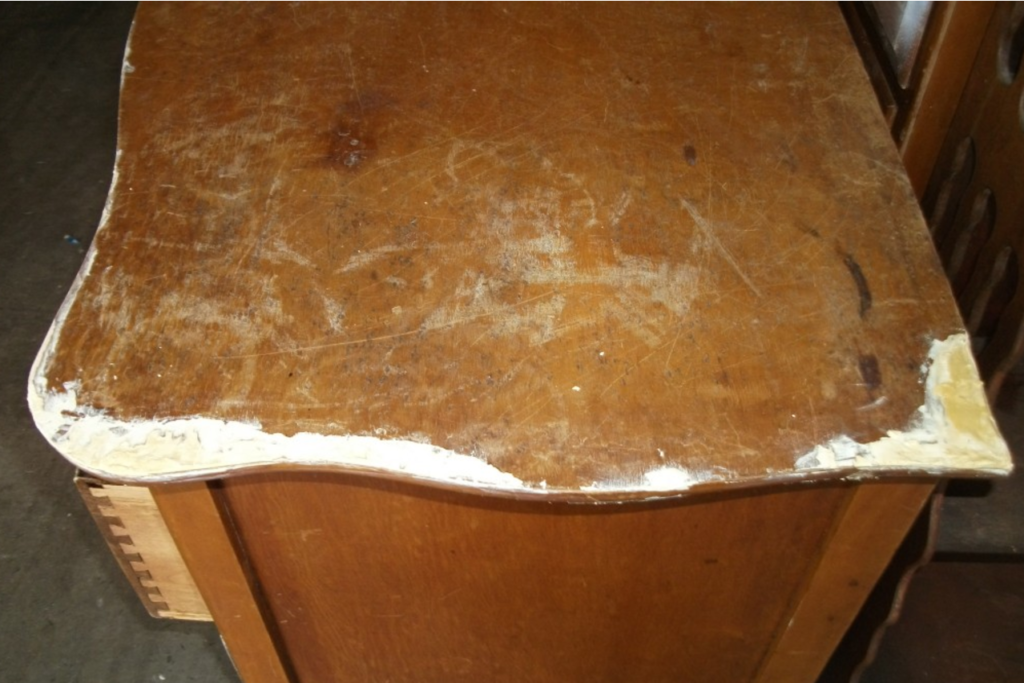 Top of damaged wood dresser