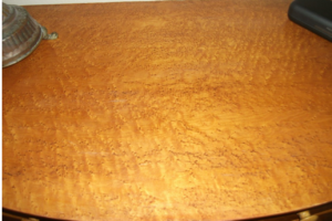 Top after refinishing damaged wood dresser